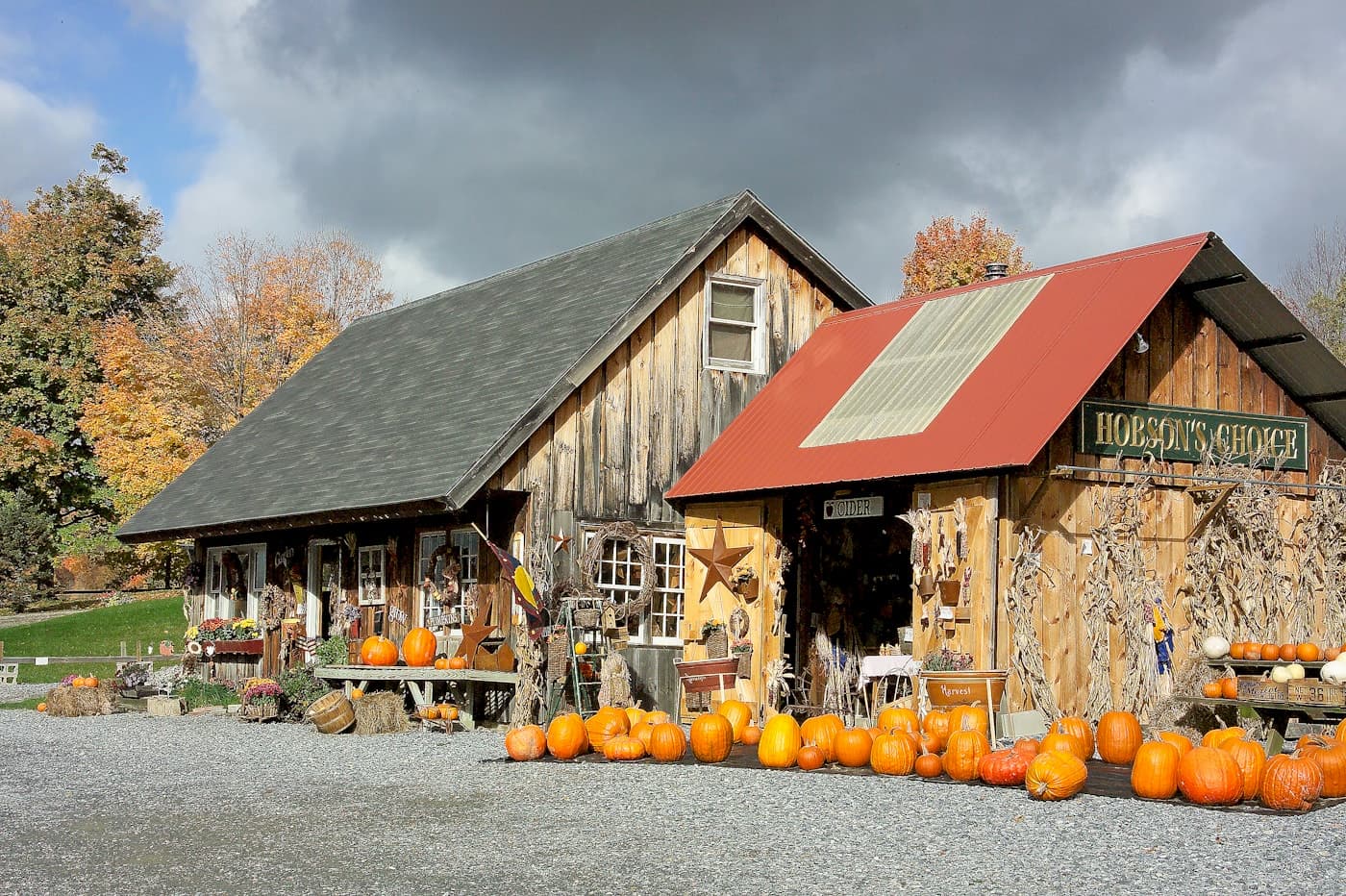 Rustic farm stand decorated with pumpkins for a fall festival