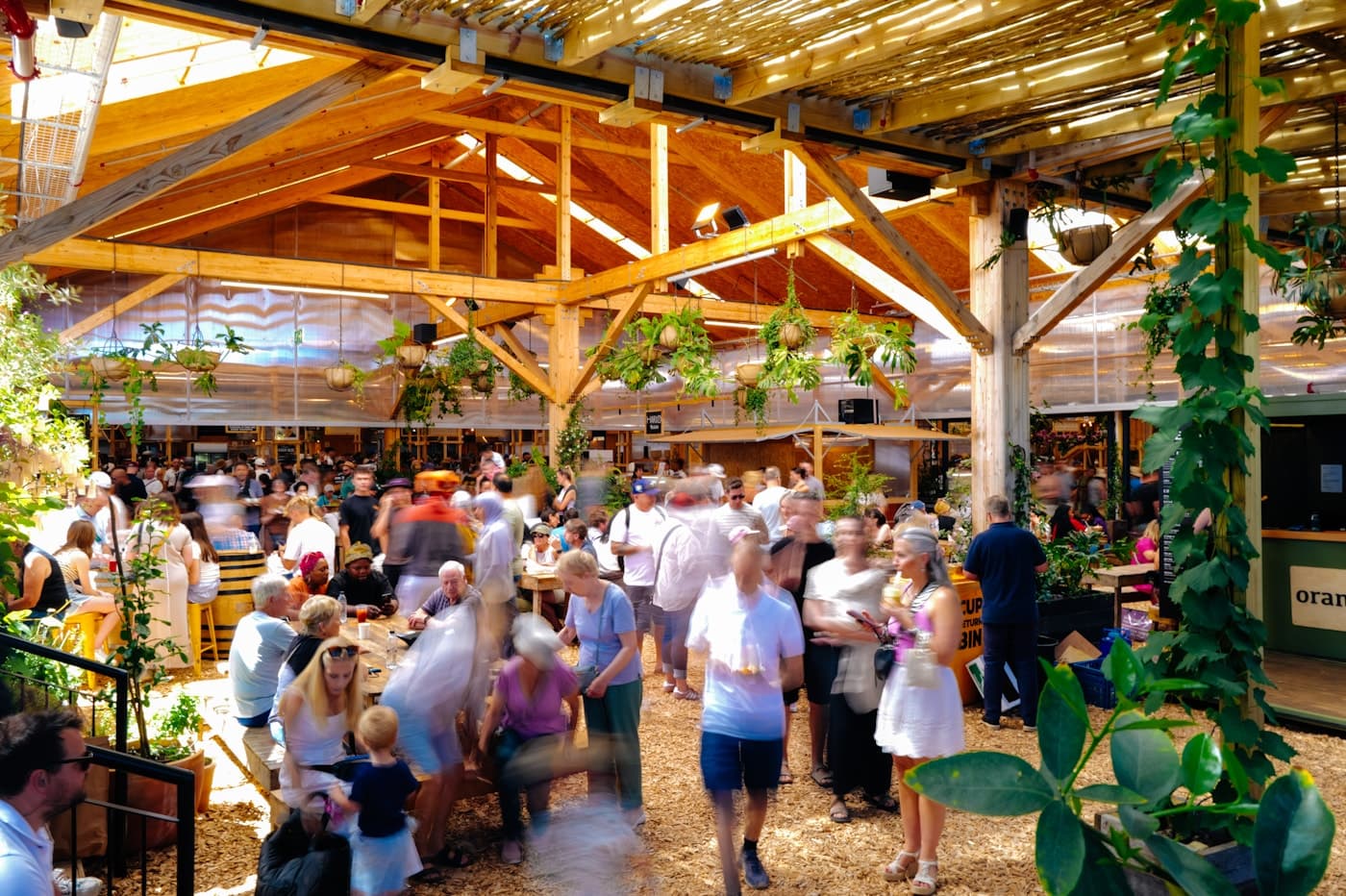 Crowd walking through a busy open-air market